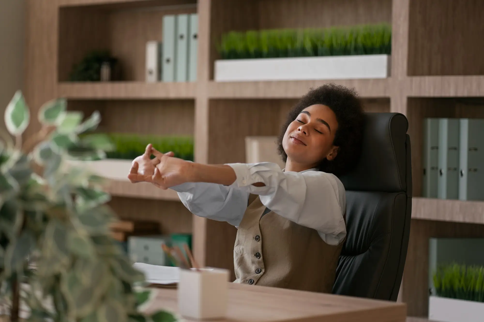 Woman stretches at desk