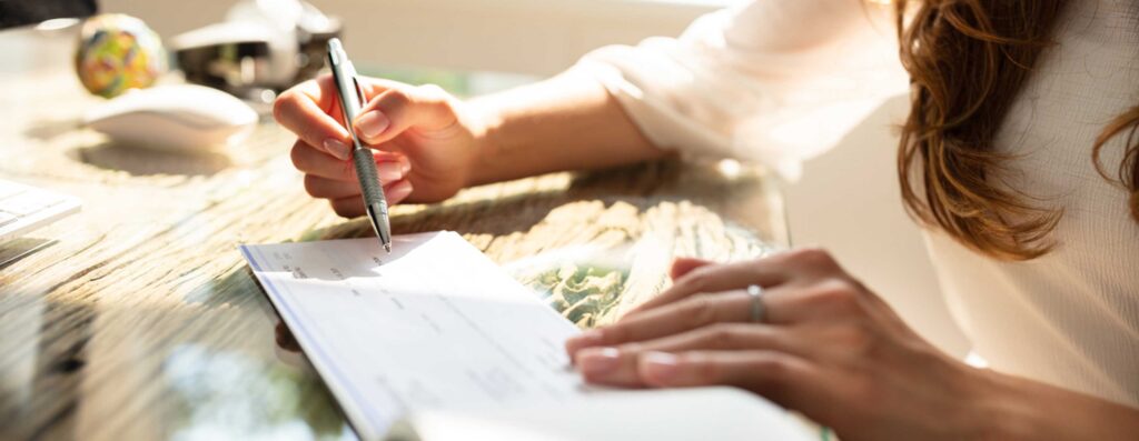Woman writing a check